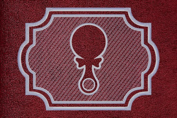 Rattle embossed embroidery design